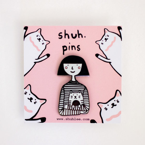 Pin with a girl character holding her cat.