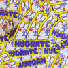 A pile of die-cut stickers featuring a white cartoon rabbit with blue glasses and the word 'HYDRATE' in purple, surrounded by a bright yellow border.