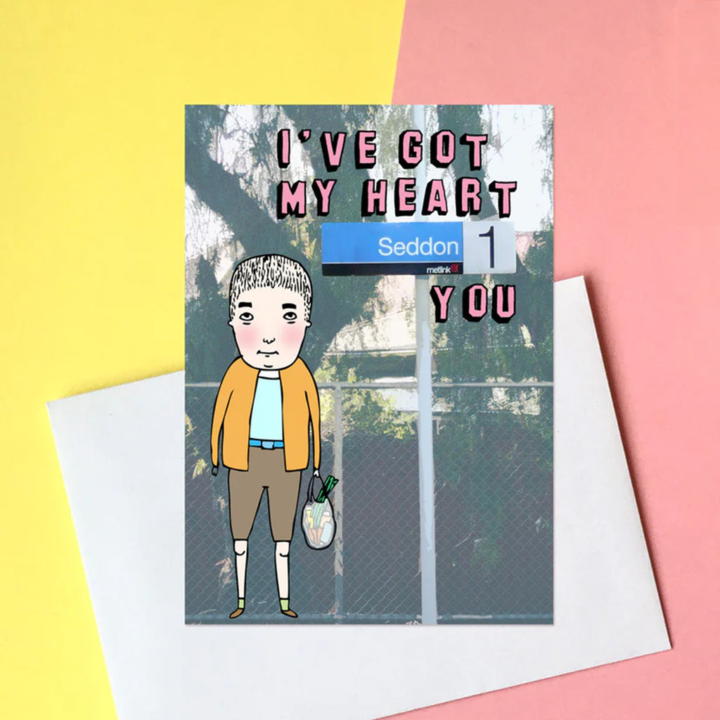 Greeting card with a character holding a bag of groceries on a colouful background