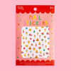 Missy Minzy nail stickers in a red and pink retail package, featuring a white sticker sheet with a colourful pattern of ice cream cones, cupcakes, and small doodles.