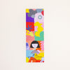 A tall, narrow rectangular bookmark featuring a colourful abstract collage with a stylised face illustration near the bottom and the text 'shuh. printed in australia shuhlee.com'.