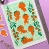 Illustrated sheet with baby tomato design on a purple background, surrounded by stickers and a ruler.