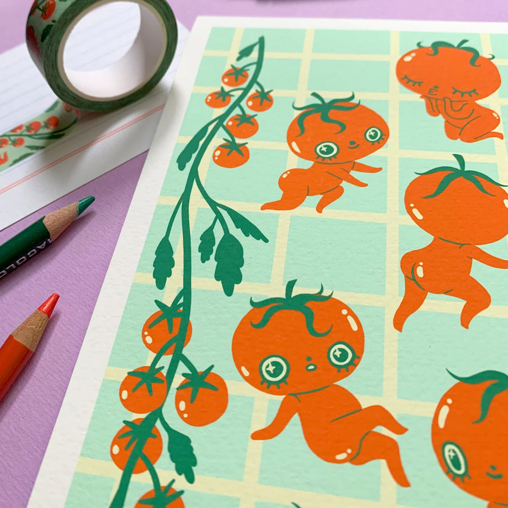 Print with cute tomato character illustrations on a purple surface with stationery items.