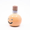Side view of the Kaori vase. Light orange colour, blue smile, multicoloured spout.