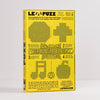 A yellow and black box for 'Le Puzz' featuring instructions and pixelated bead designs on the front, photographed against a neutral light grey background.