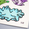 A close-up of a white art print featuring a stylised illustration of a light blue mushroom with black outlines, along with partial purple and green floral elements. The artist's signature 'ILIN' is visible in the bottom right corner.