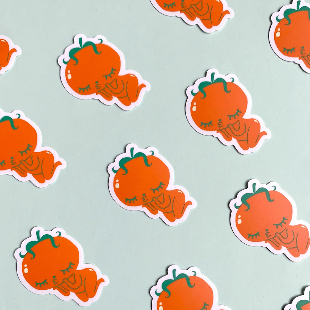 Pattern of cartoonish pumpkins with faces on a light mint background