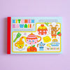 A cute and colourful cover of a colouring postcard book against a lilac background.