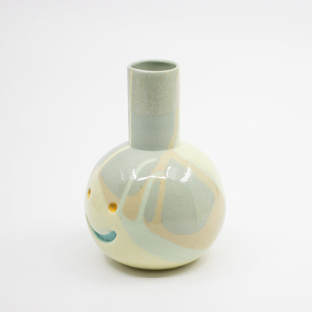 Ceramic vase with abstract design on a white background