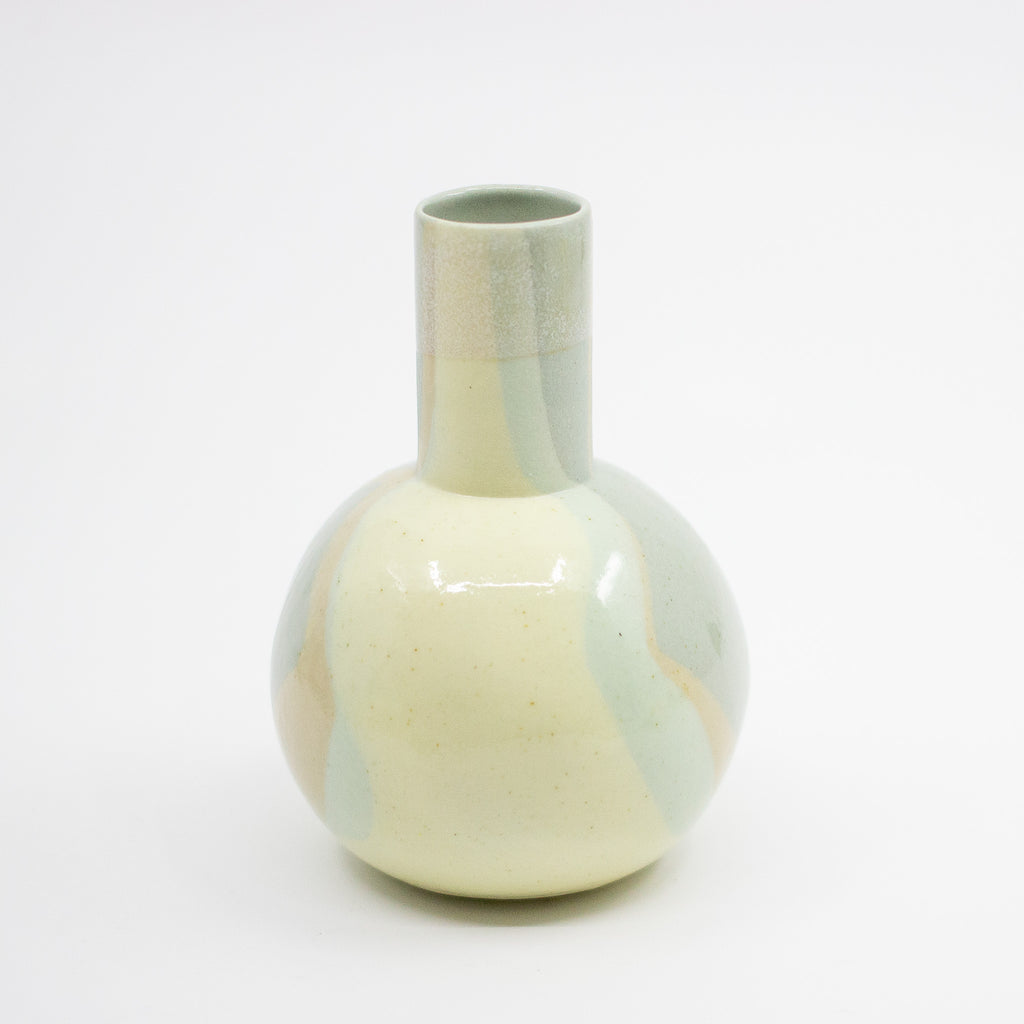 Ceramic vase with marbled design on a white background