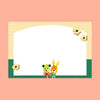 A rectanbgular writing card with a large blank white center, a pale yellow grid border, a dark green bottom band, and two small cartoon animals at the bottom center.