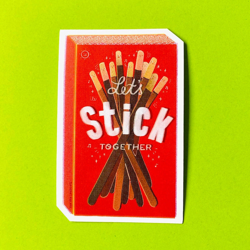 A rectangular sticker featuring a red matchbox-style design with the words 'Let's Stick Together' and an illustration of assorted stick-like treats, shown on a bright lime green background.