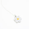 Sterling silver necklace featuring a light white ceramic flower-shaped pendant with a yellow dot in the centre, displayed on a white background.