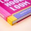 Colourful book with 'LOOM' and 'SOPHIA CAI' on a peach background