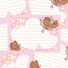Pink and white stationery cards featuring cute cartoon cupid illustrations, pastel hearts, stars, and lined writing areas.