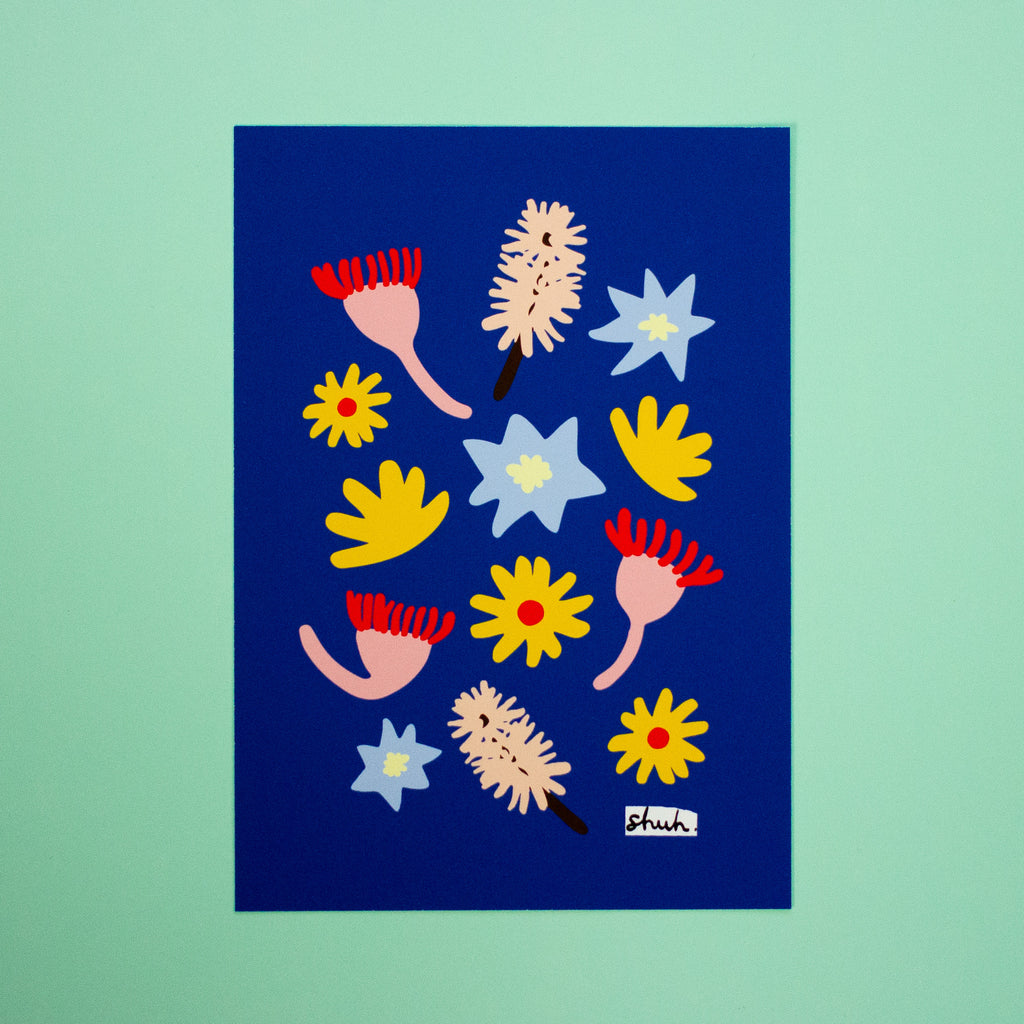 Meadow A5 art print by shuh. featuring a vibrant mix of abstract native-style flowers in red, yellow, pink and blue on a deep blue background