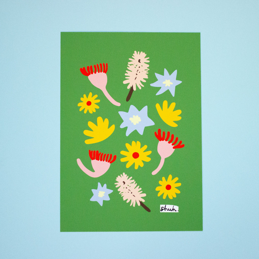 Meadow A5 art print by shuh. featuring colourful abstract flowers in red, yellow, pink, and light blue arranged on a bright green background.