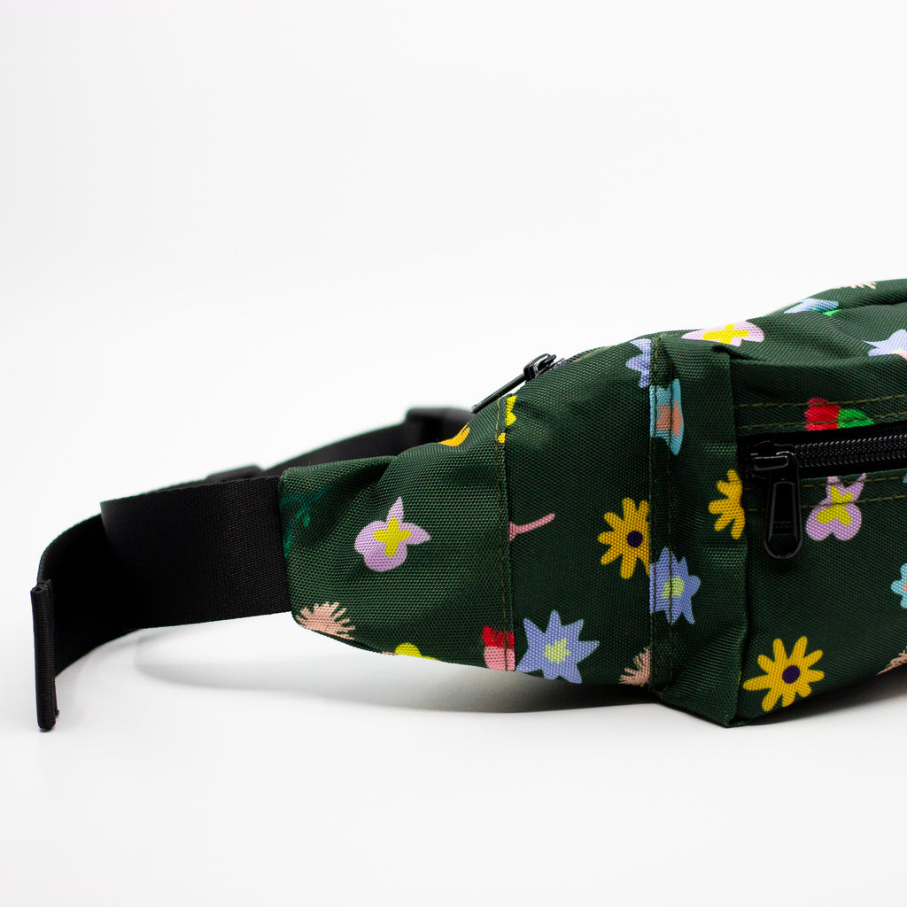 Green fanny pack with colorful floral patterns on a white background