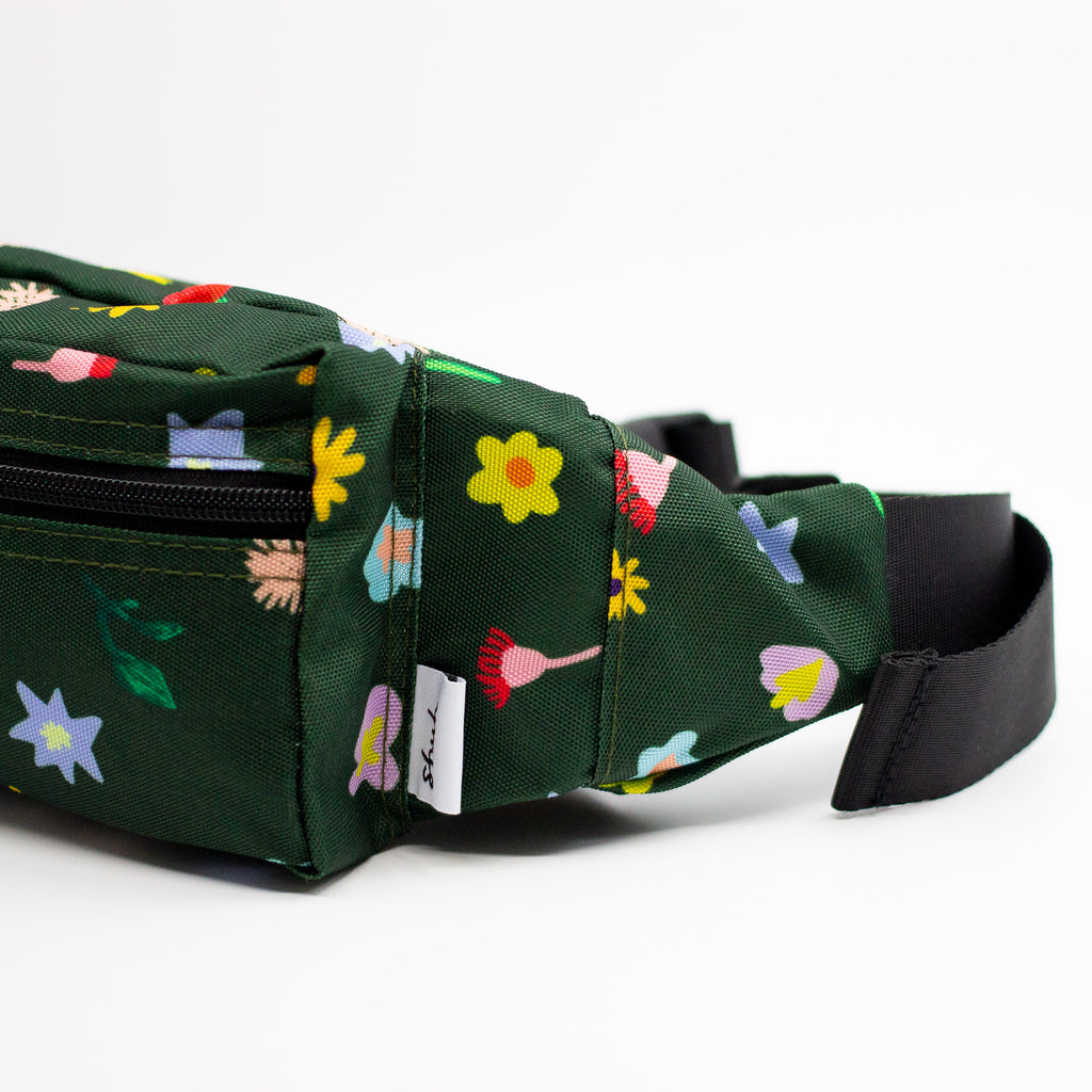 Green waist bag with floral pattern on a white background