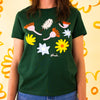 A second Front view of the meadow tee, showing lower hemline. Green coloured tee with printed native flowers.