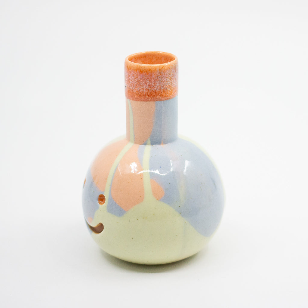 Ceramic vase with abstract design on a white background