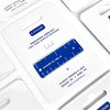 A close-up of a blue two-tone acrylic keychain ruler inside its white retail packaging, with printed text including 'PRECISION LASER CUT TWO TONE ACRYLIC KEYCHAIN' and 'ALWAYS FRIENDS by Ruby PH'.