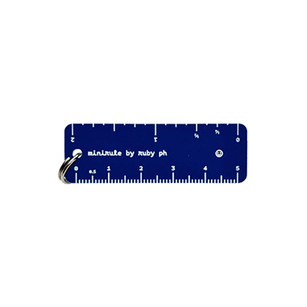 A navy blue keychain ruler with white markings and a silver metal keyring, branded 'minirule by ruby ph' on a plain white background.