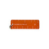 An orange pocket ruler with white markings and a silver metal keyring, featuring the text 'minurule by ruby ph' on a solid white background.