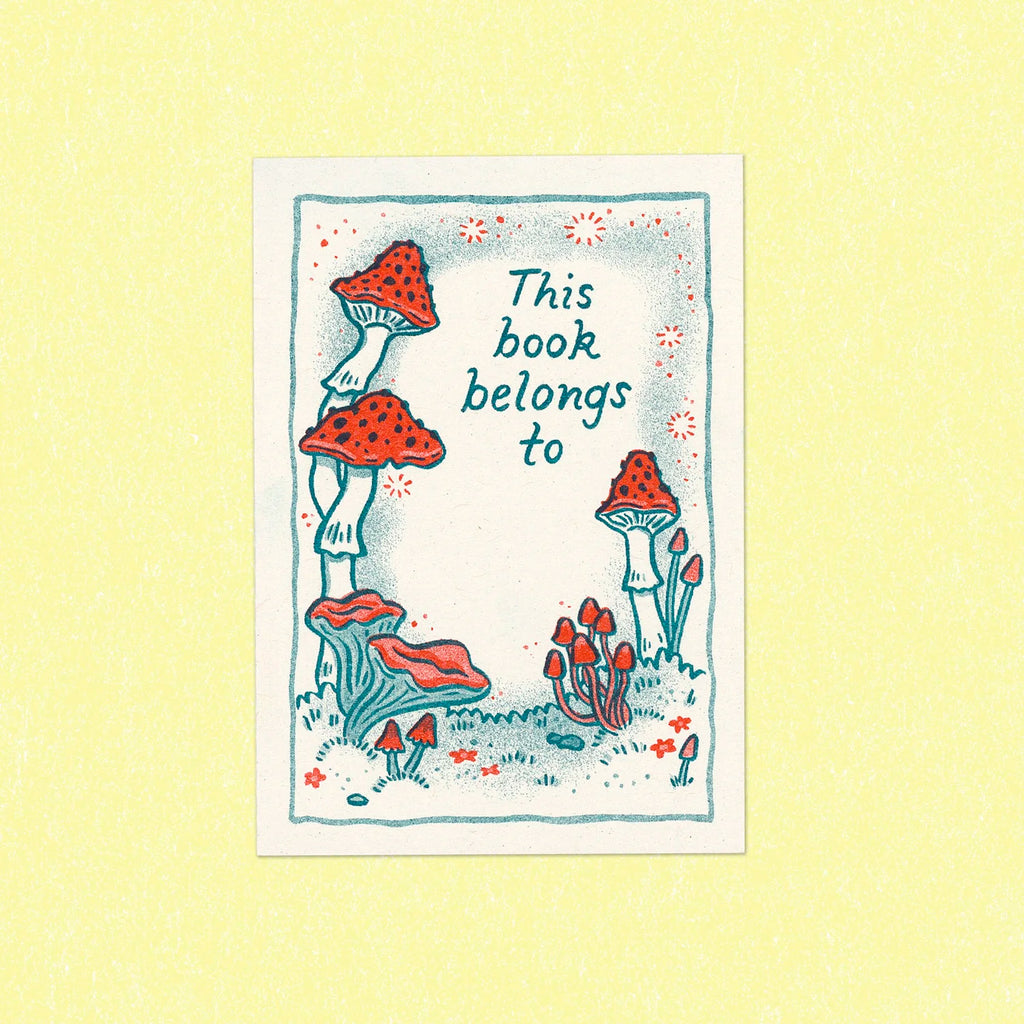 Illustrations of mushrooms on paper with words 'This book belongs to'.