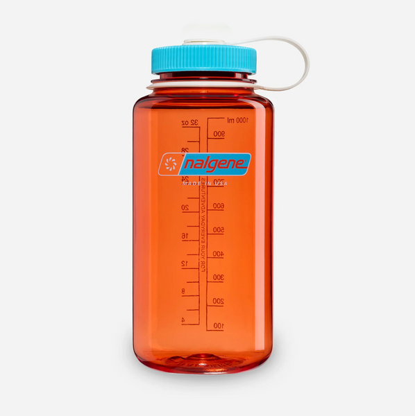 An orange translucent plastic water bottle with a bright blue cap and white carrying loop, featuring the 'nalgene' brand logo and measurement markings on a light grey background.