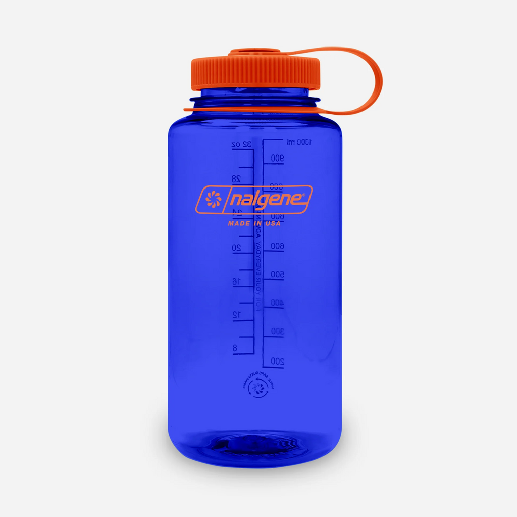 Blue water bottle with orange cap on a white background
