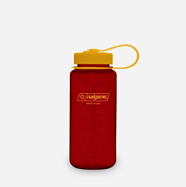 A translucent red Nalgene water bottle with a mustard screw cap and matching yellow carrying loop, shown on a clean light grey background.