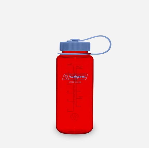 A translucent red Nalgene water bottle with a blue screw cap and matching blue carrying loop, shown on a light grey background.