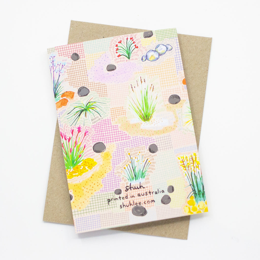 A front view of the Native print card. Multiple native plants over a colourful grid background.