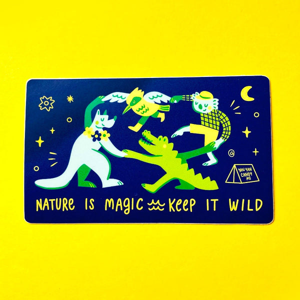 A rectangular sticker with rounded corners featuring a dark blue background and colourful cartoon animals in green, yellow, and white, with the text 'NATURE IS MAGIC KEEP IT WILD' at the bottom, displayed on a bright yellow background.