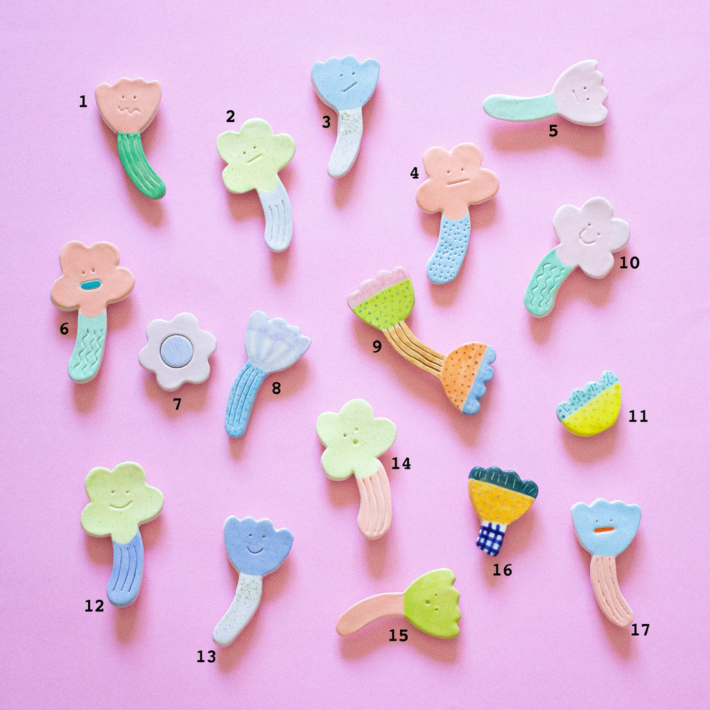 A topview of the nice day collection of fridge magnets by shuh. Each is numbered so that you can choose which you'd like to buy. 