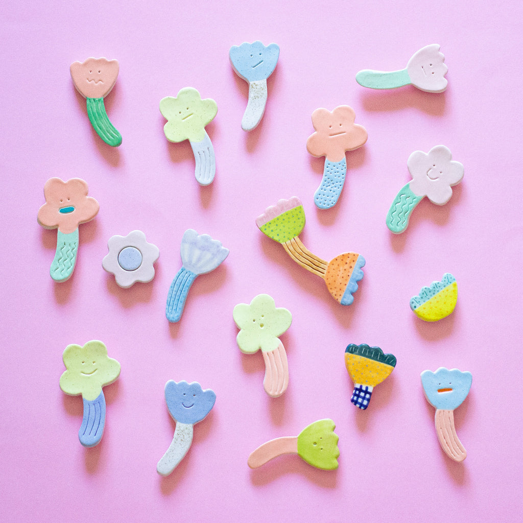A topdown view of the nice day collection of fridge magnets by shuh. 