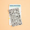 A travel card sticker sheet featuring black hand-drawn doodle illustrations on a white backing card, displayed on a solid peach background. The brand name 'Hannakin' is visible on the header card.