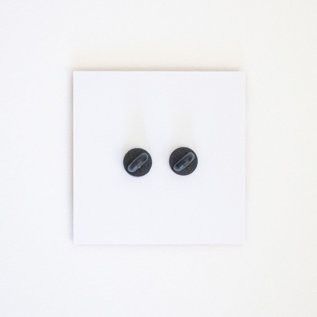 Picture of the back of the card and pins attached, showing the pin clasp. 