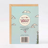 The back of a Wally Paper Co greeting card in a light blue textured paper, featuring a kraft envelope, with illustrated clouds, shape of Australia, and a barcode.