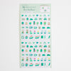 A sheet of cute daily planner stickers with various illustrated characters, animals, and objects in shades of green, teal, and pastel colours, presented on a light mint green backing card.