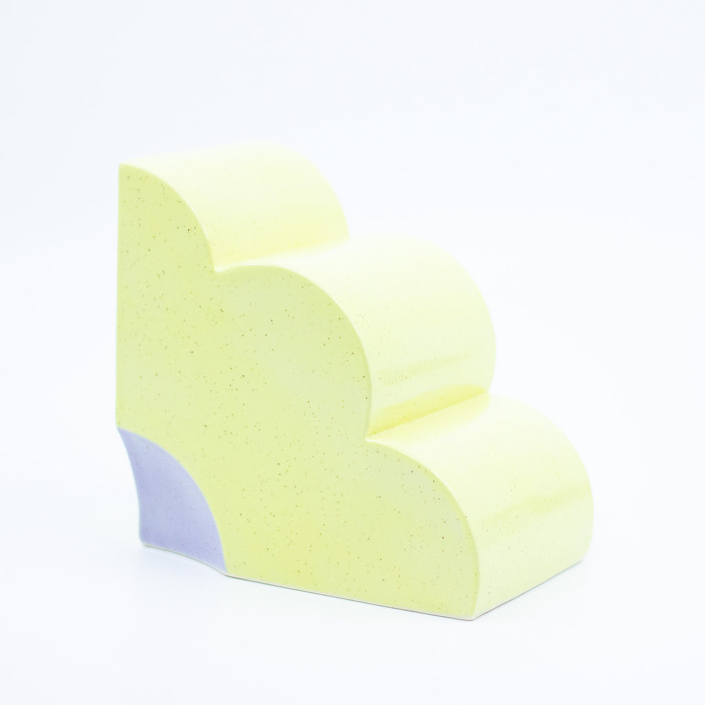 Side view of Pansy quarter flower bookend. 