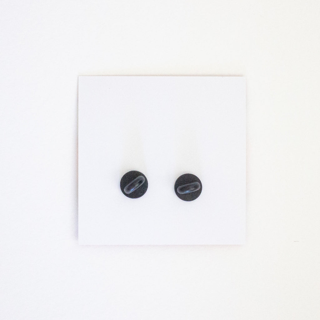 Picture of the back of the card and pins attached, showing the pin clasp. 