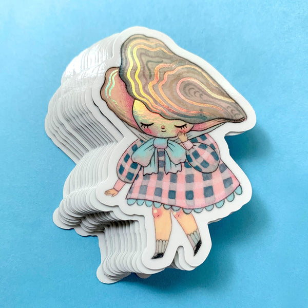 Stack of illustrated stickers with a girl in a dress and hat on a blue background