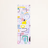 A tall, narrow rectangular bookmark featuring a colourful abstract pattern on a white background, displayed against a solid off-white backdrop.