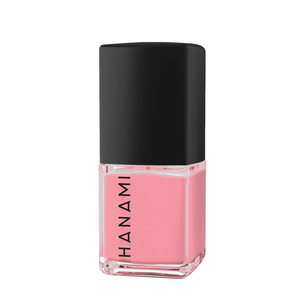 Pink nail polish bottle with black cap on a white background