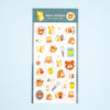 A sheet of cute cartoon stickers from 'valo's kitchen' featuring teddy bears, toast, and breakfast items, displayed on a light blue background.