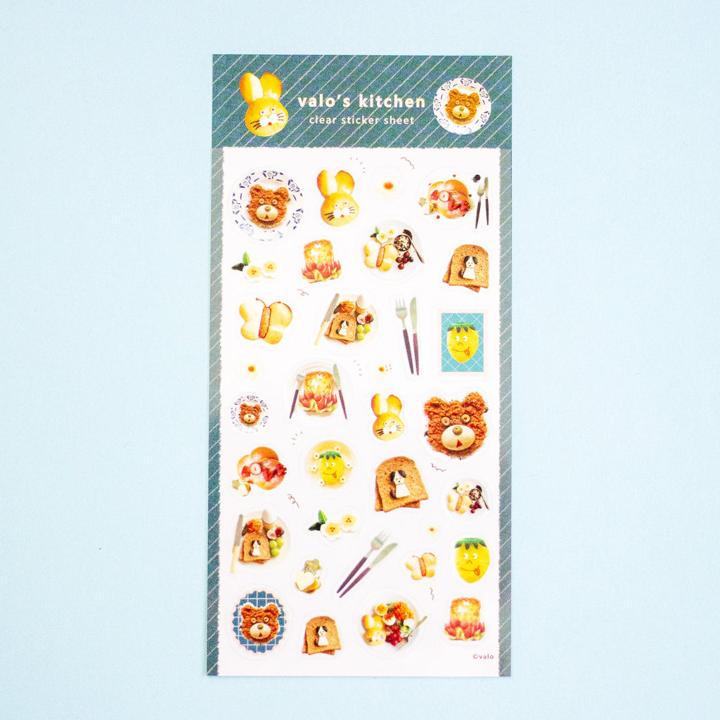 A sheet of cute cartoon stickers from 'valo's kitchen' featuring teddy bears, toast, and breakfast items, displayed on a light blue background.