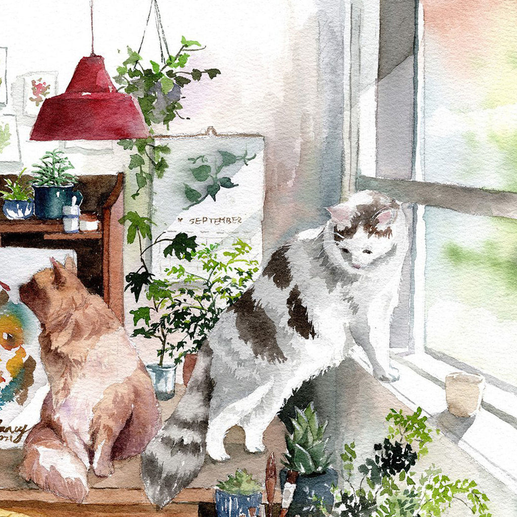 Two cats sitting on a windowsill with plants and a red lampshade.