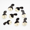 A Top View of the Ponytail collection of ceramic brooches. 
